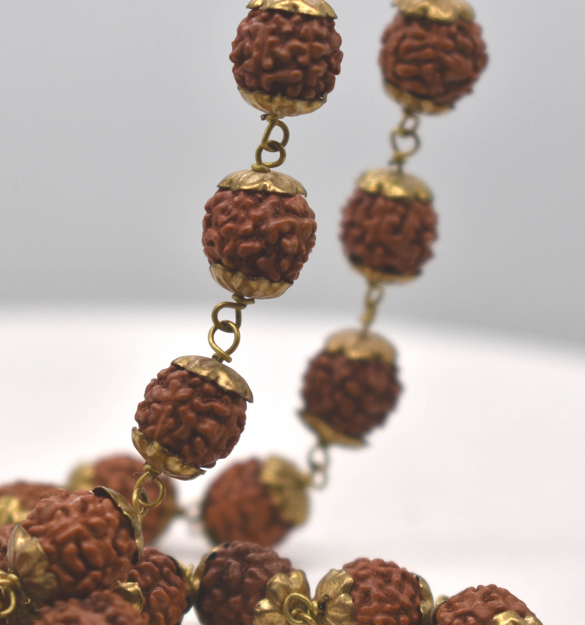 Natural Rudrakshas in Brass