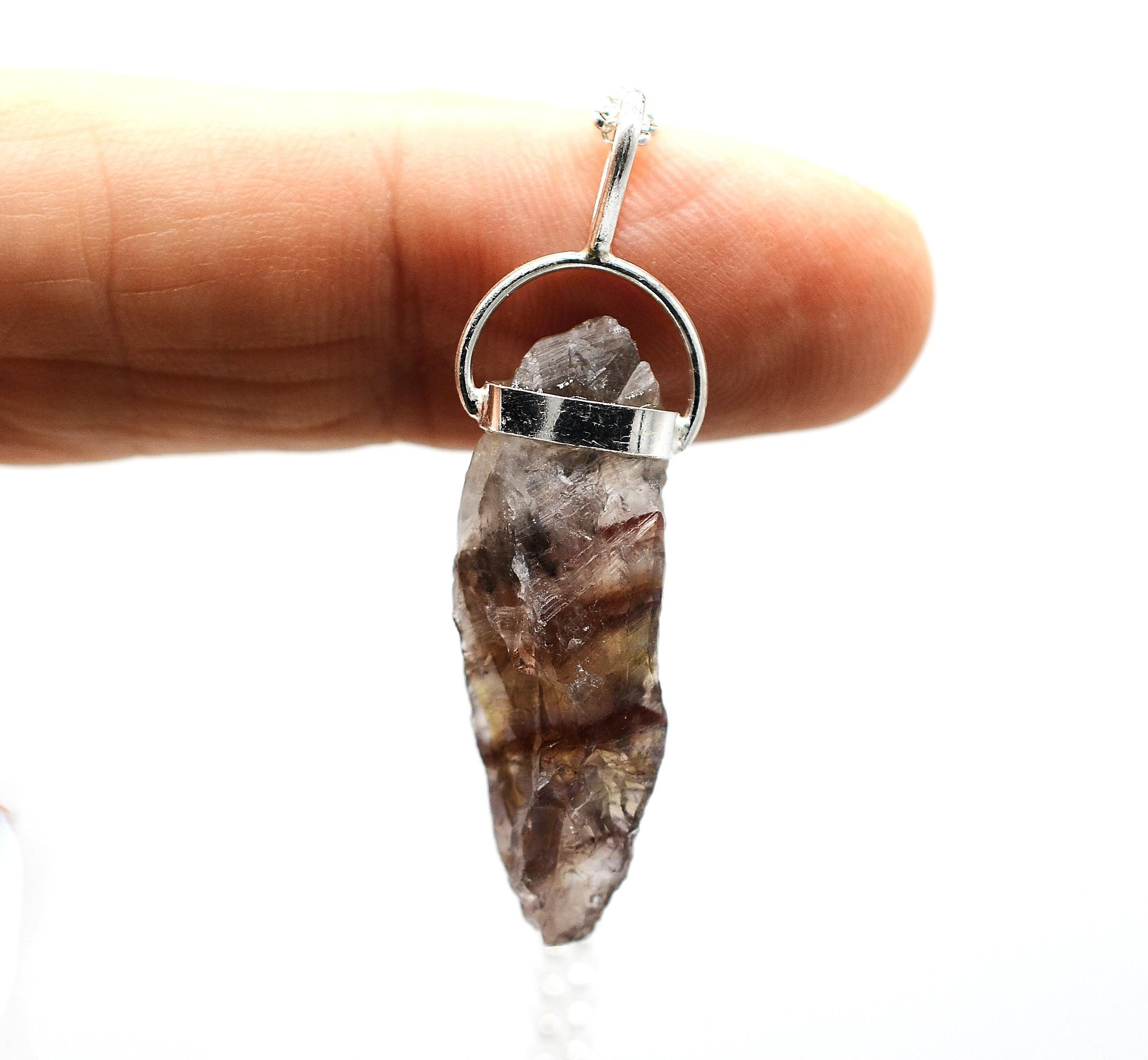 Super 7 Silver Pendant: Ethically Mined Natural Crystal