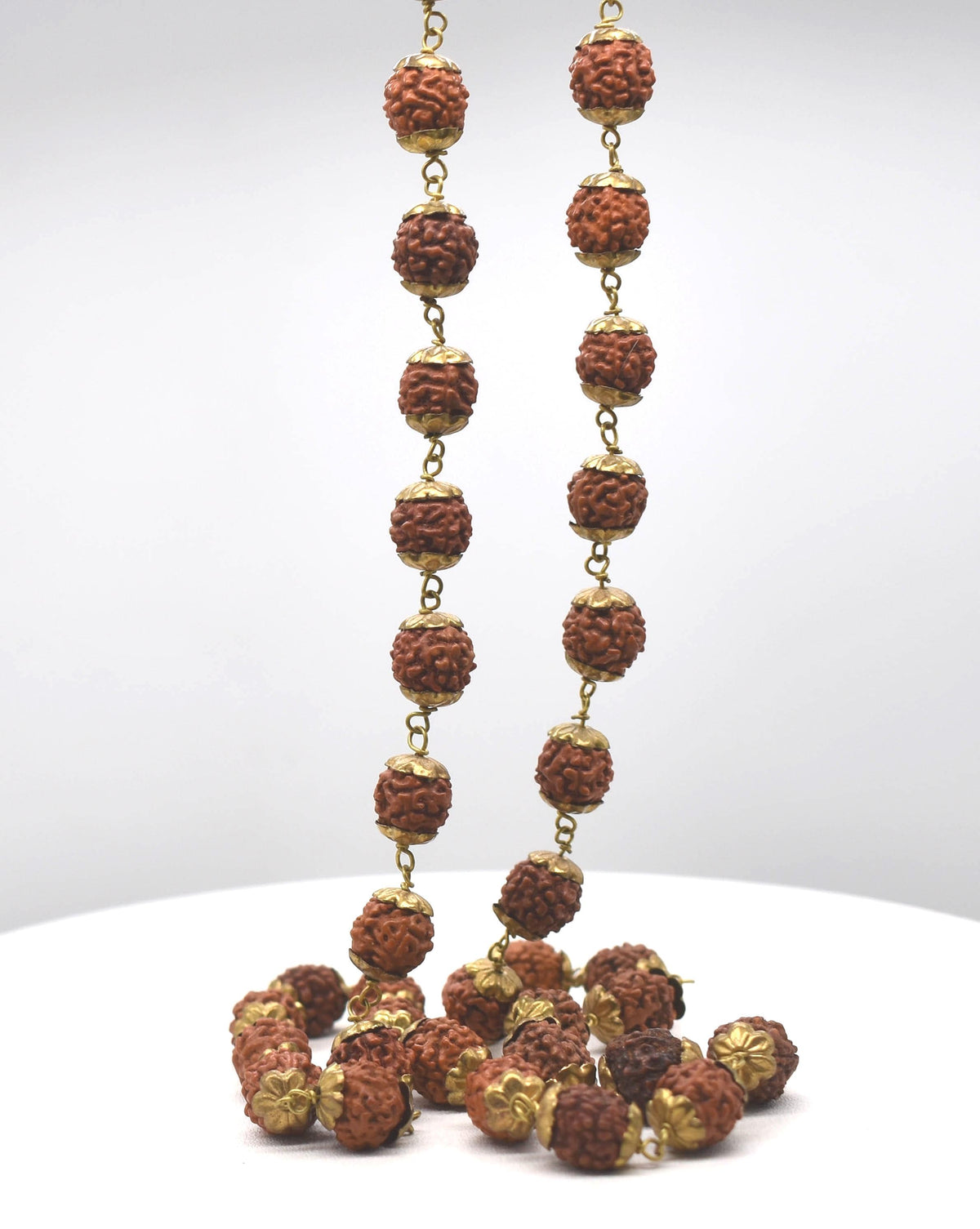 Natural Rudrakshas in Brass