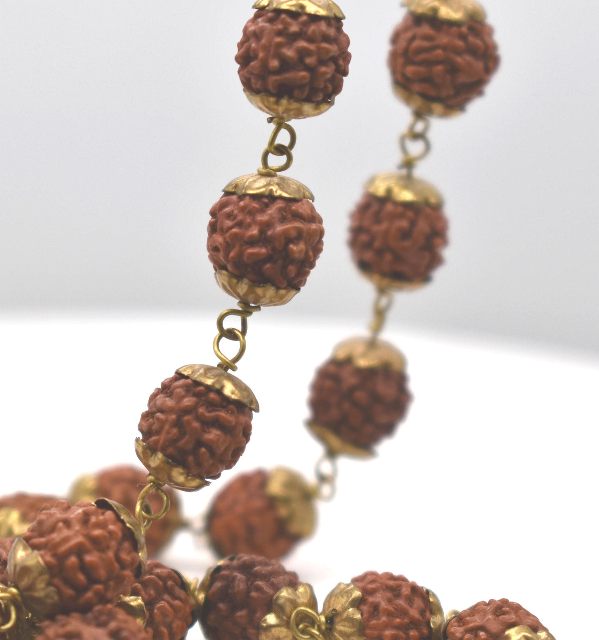 Natural Rudrakshas in Brass